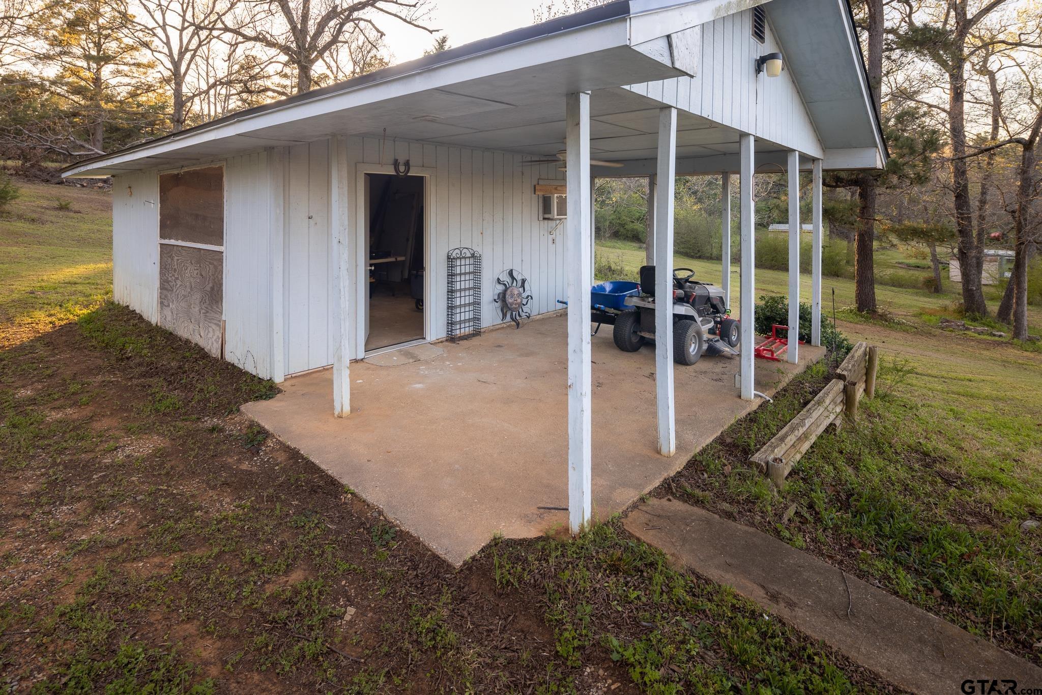 10733 County Road 4150 Tyler, TX 75704 - Photo 35 of 48 a view of a house with backyard and porch