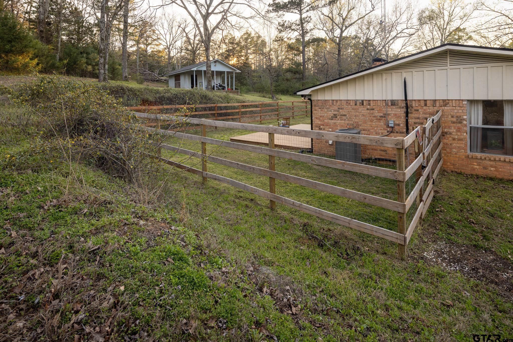 10733 County Road 4150 Tyler, TX 75704 - Photo 39 of 48 a view of a house with a yard