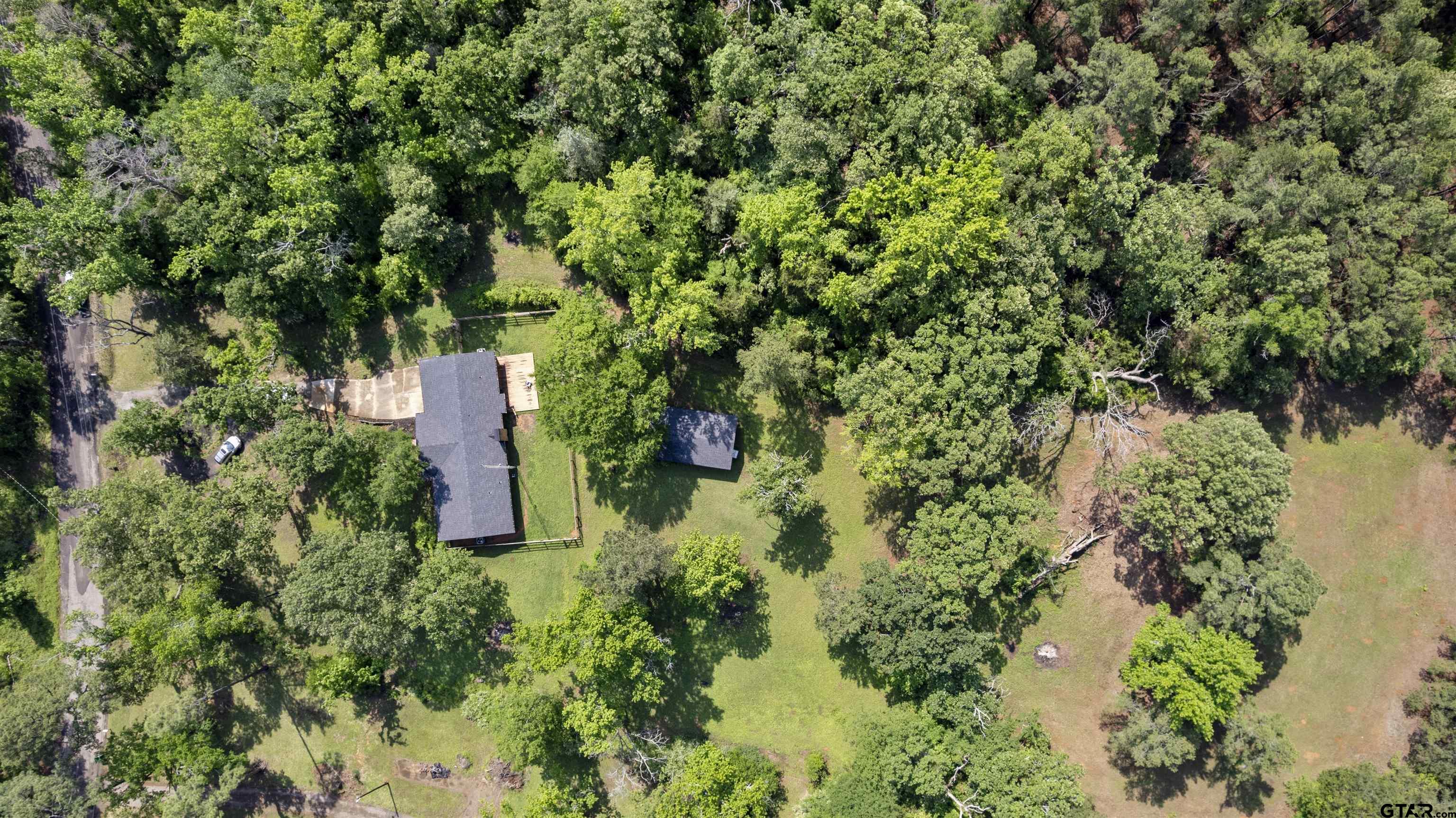 10733 County Road 4150 Tyler, TX 75704 - Photo 47 of 48 an aerial view of residential house with outdoor space and trees all around
