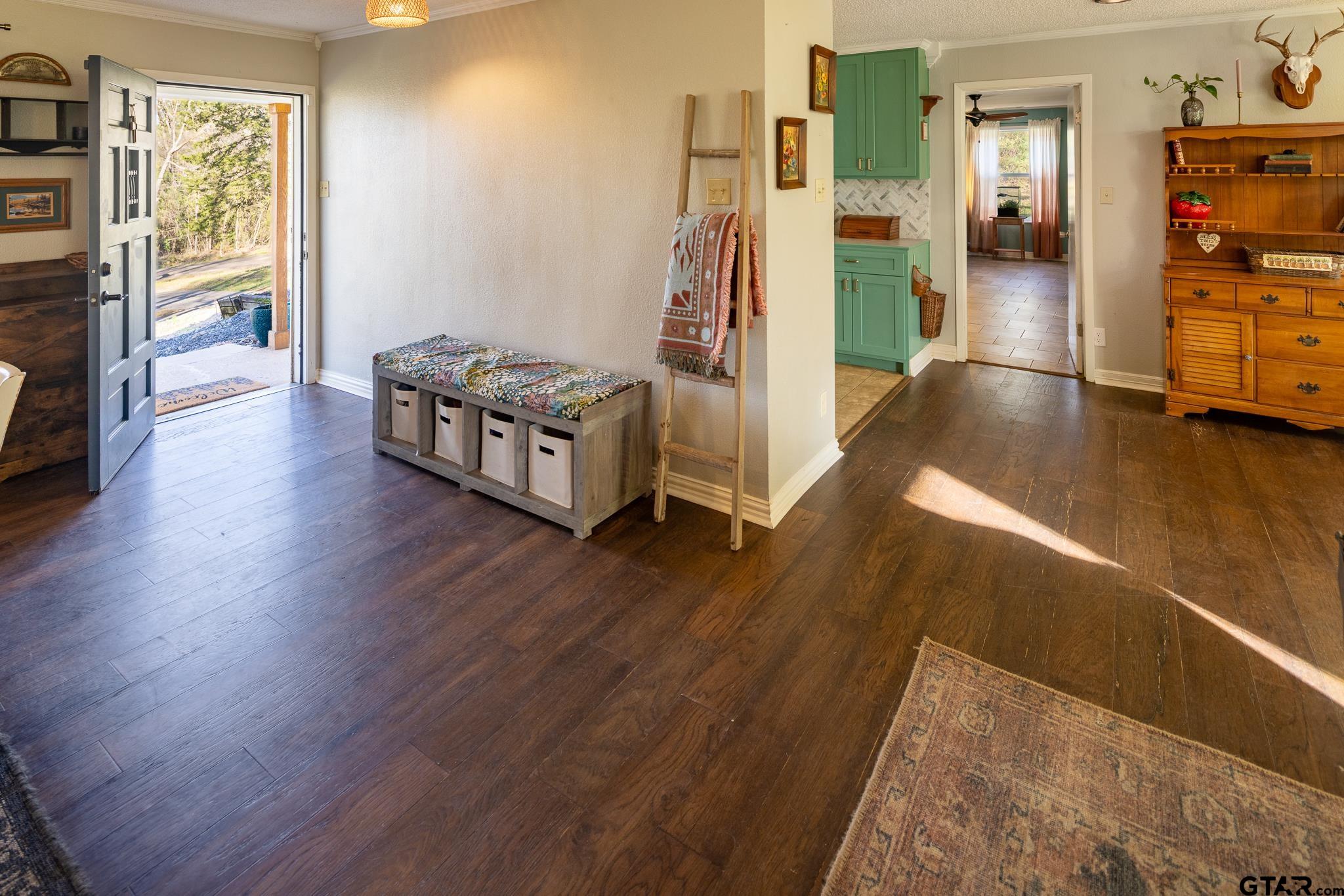 10733 County Road 4150 Tyler, TX 75704 - Photo 9 of 48 a living room with furniture and a wooden floor