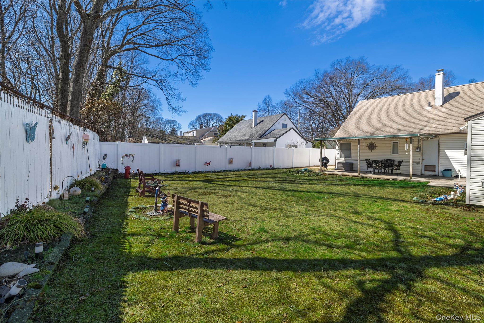712 Nightingale Road West Hempstead, NY 11552 - Photo 19 of 23 Fenced backyard with a patio area