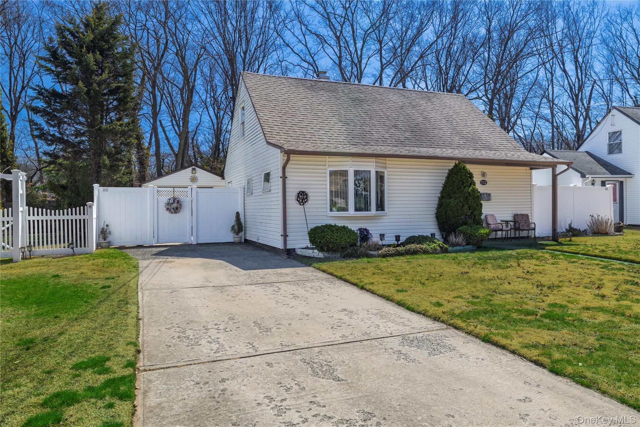 712 Nightingale Road West Hempstead, NY 11552 - Photo 23 of 23 View of front of home featuring concrete driveway, and ample parking