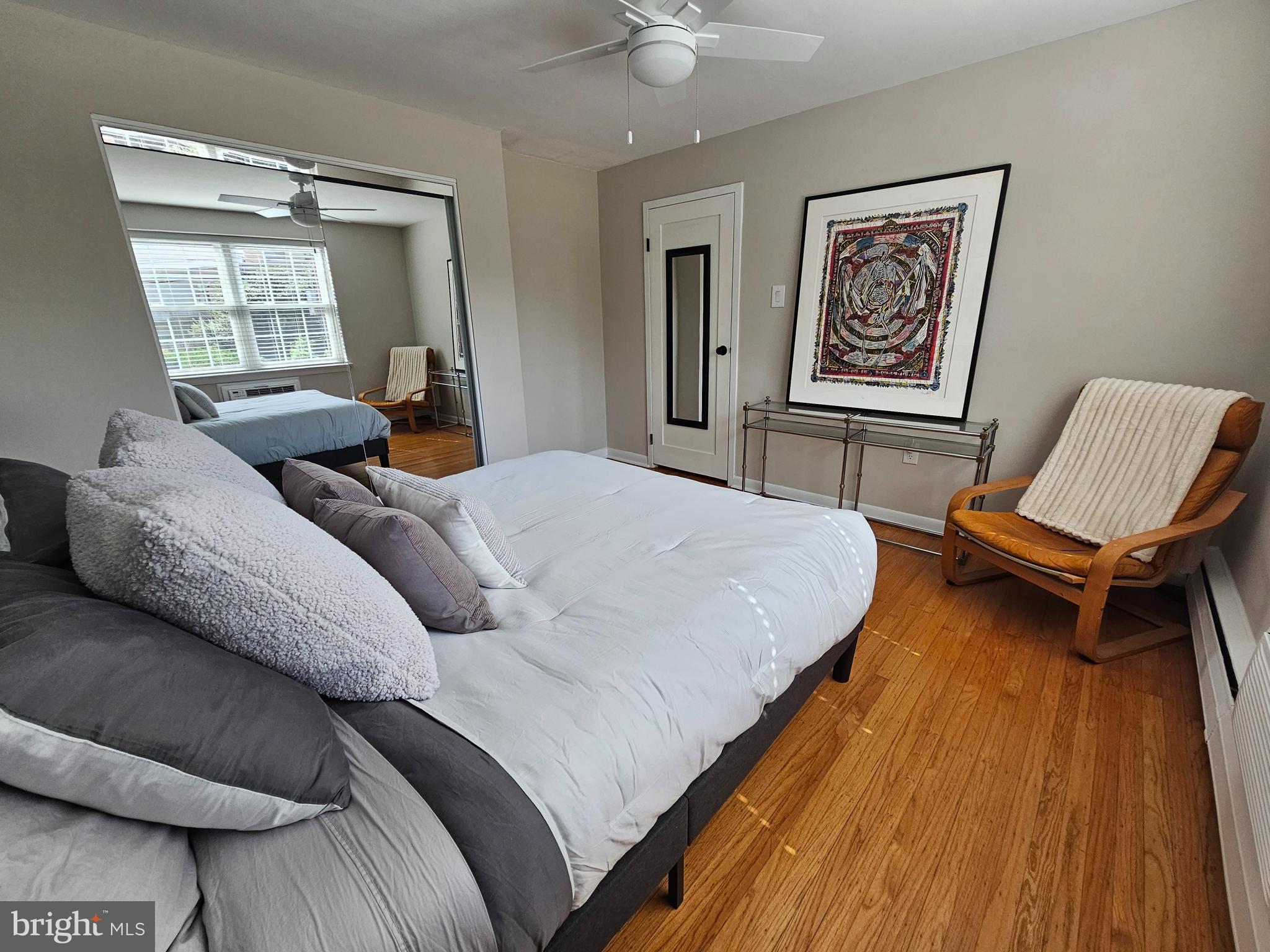 1334 Montgomery Avenue, Unit B1 Narberth, PA 19072 - Photo 15 of 17 a bedroom with a bed and wooden floor