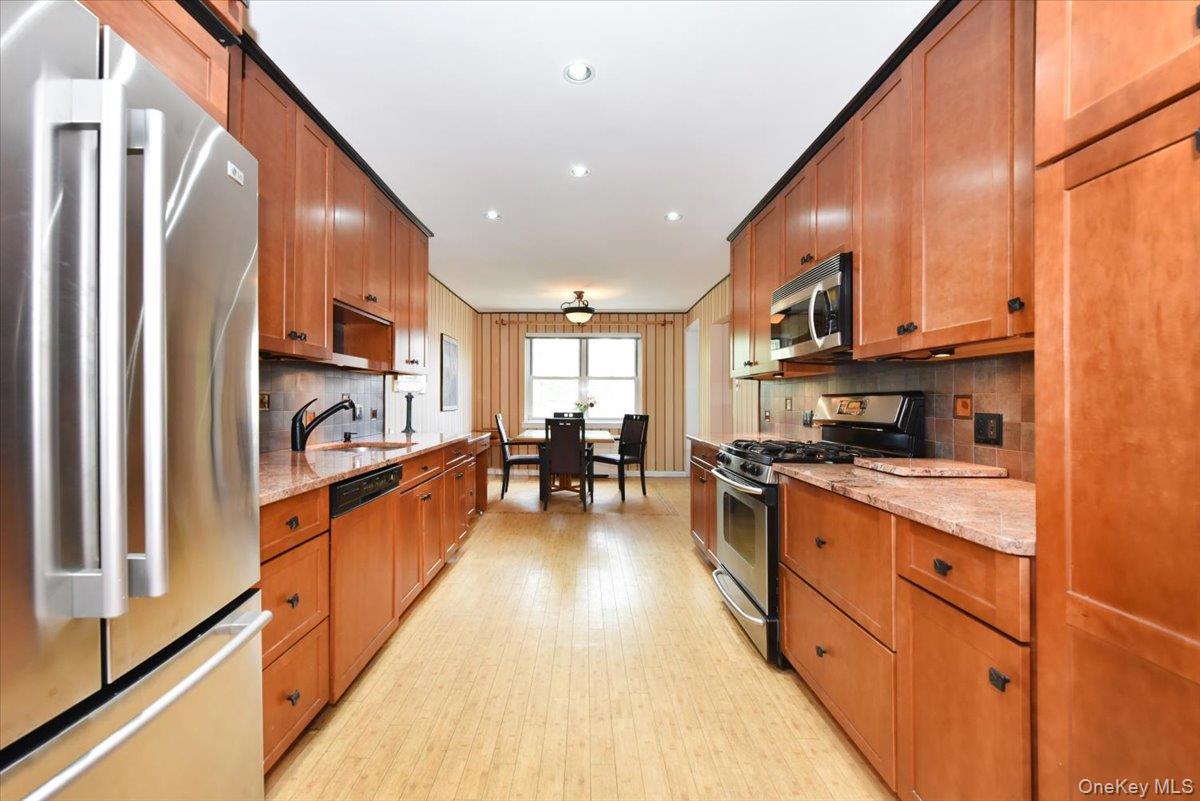 180 South Middle Neck Road, Unit 3K Great Neck, NY 11021 - Photo 5 of 20 Wide Long Kitchen with granite counters + Stainless fridge