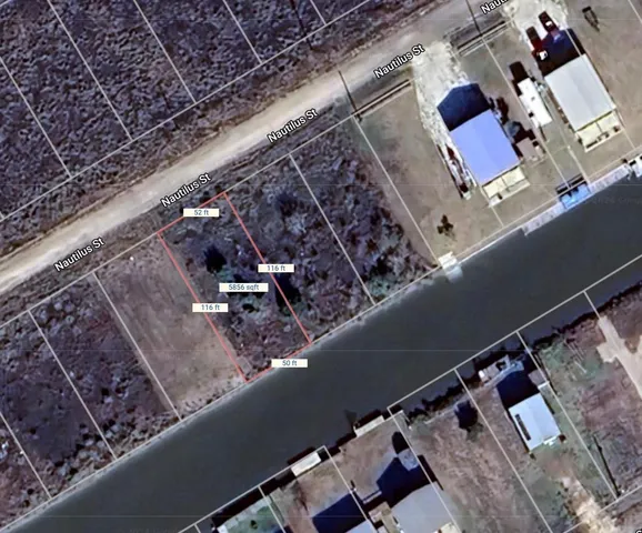 a view of a lake with houses in the back