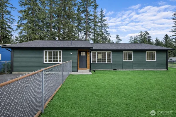 a front view of a house with yard