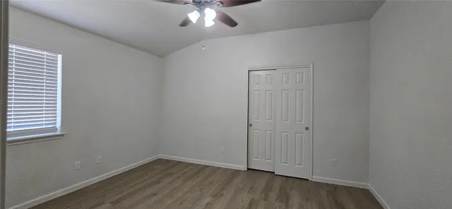 an empty room with a hardwood