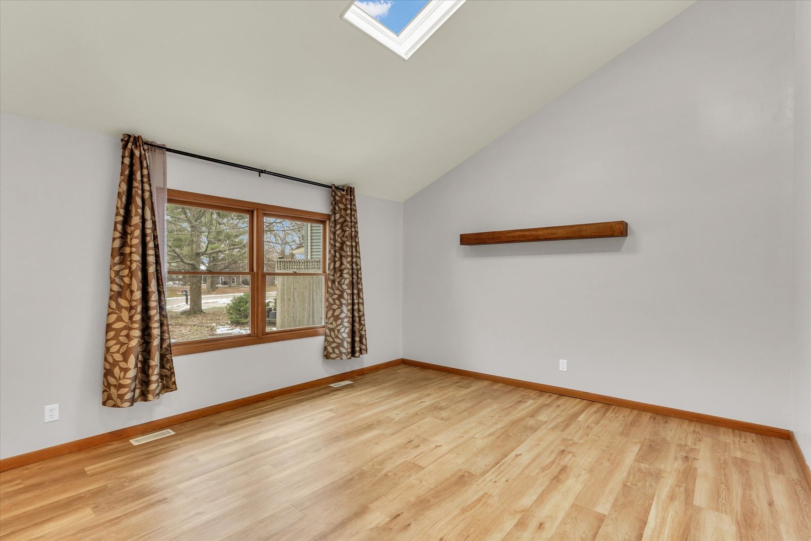 1908 Barberry Circle Champaign, IL 61821 - Photo 12 of 33 an empty room with wooden floor and windows
