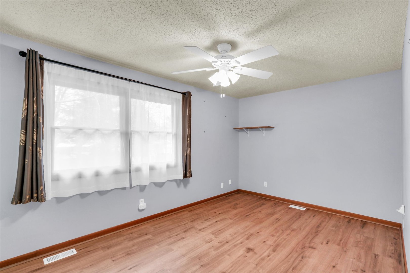 1908 Barberry Circle Champaign, IL 61821 - Photo 16 of 30 wooden floor in an empty room with a window
