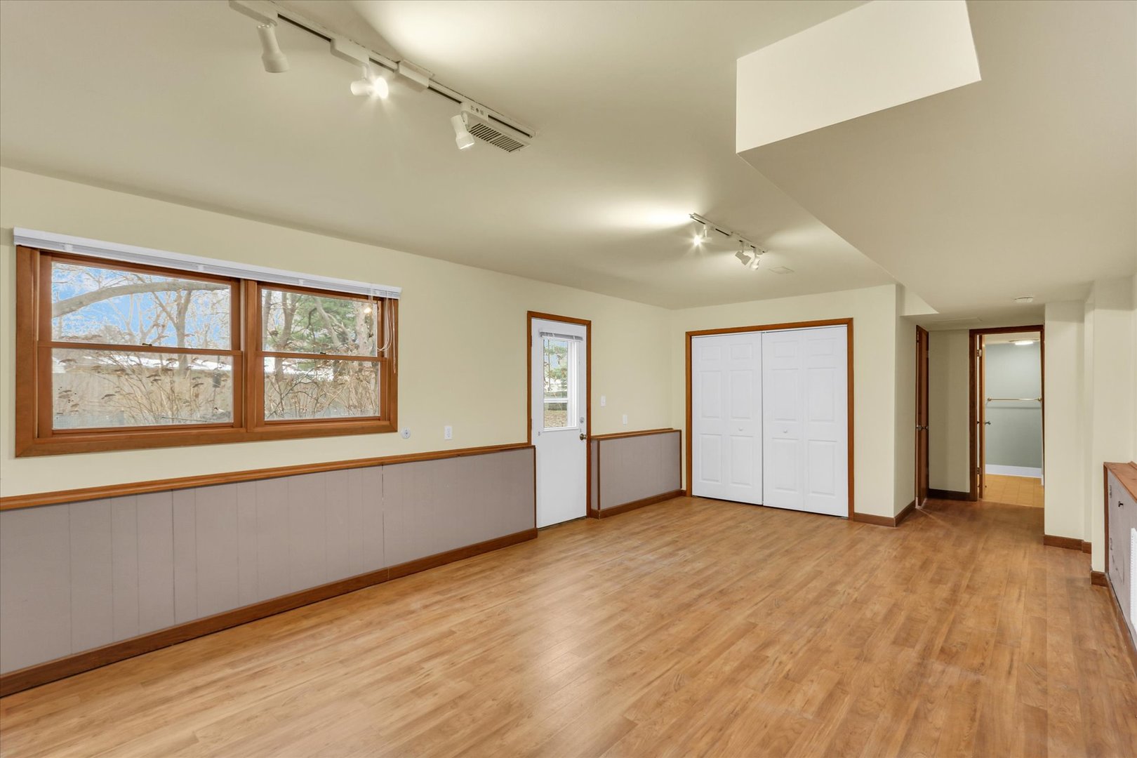 1908 Barberry Circle Champaign, IL 61821 - Photo 21 of 33 an empty room with wooden floor and windows