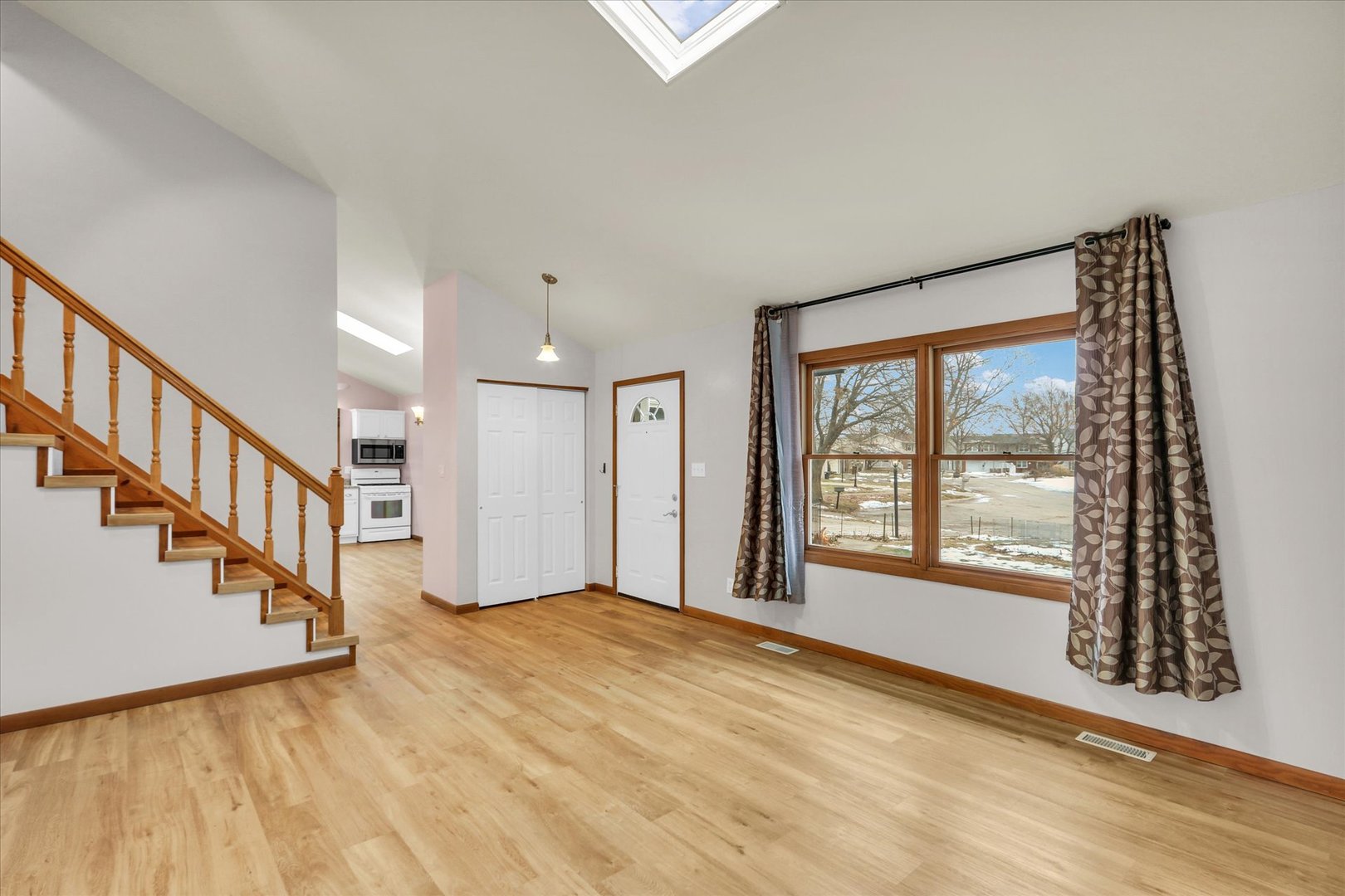 1908 Barberry Circle Champaign, IL 61821 - Photo 7 of 30 a view of an empty room with wooden floor and a window