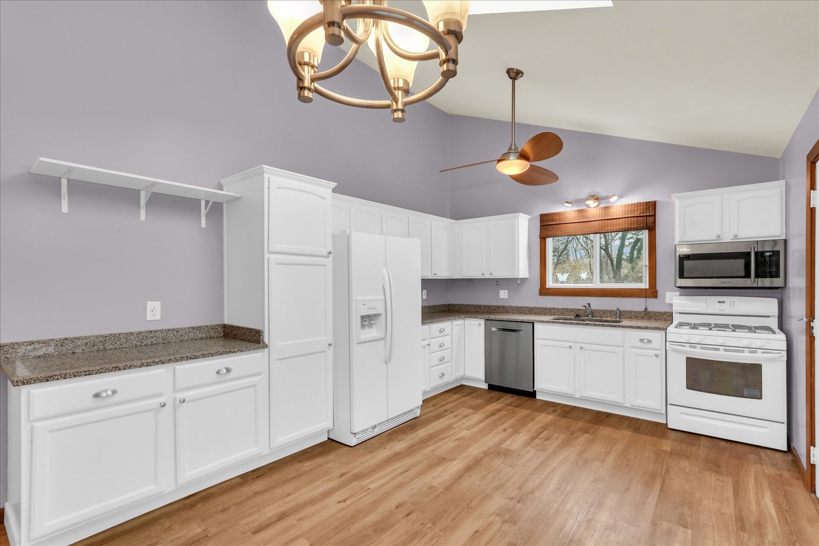 1908 Barberry Circle Champaign, IL 61821 - Photo 9 of 33 a kitchen with a white cabinets and window