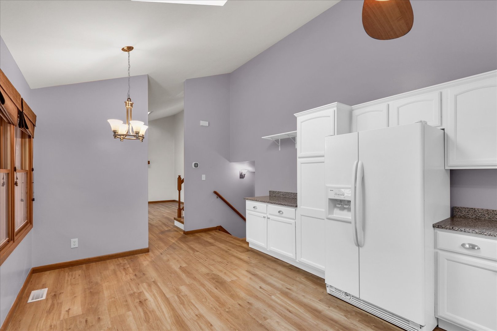 1908 Barberry Circle Champaign, IL 61821 - Photo 9 of 30 a open kitchen with white cabinets and refrigerator