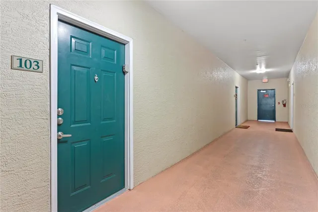 a view of hallway with closet area