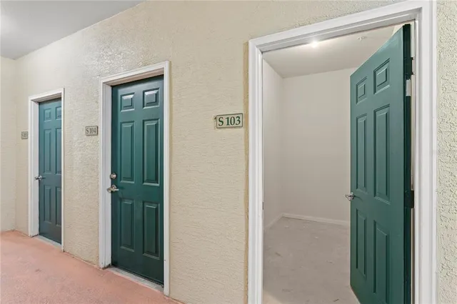 a view of a bathroom from a hallway