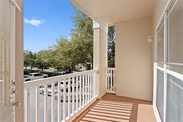 a view of a balcony with wooden floor