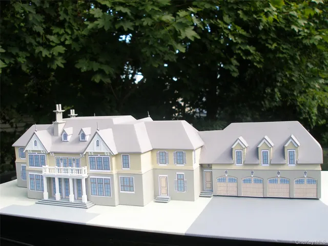 a aerial view of a house with a yard