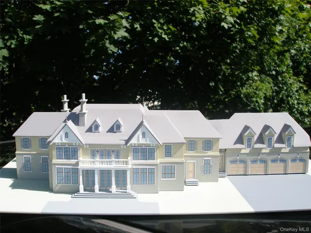 a view of a balcony with a couple of cars parked in front of it