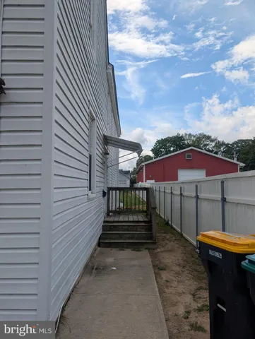 a view of a patio with wooden floor