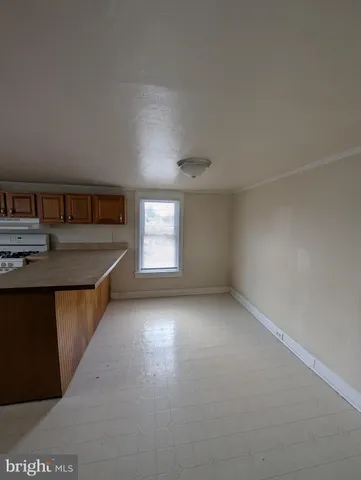 a kitchen that has a sink and a stove