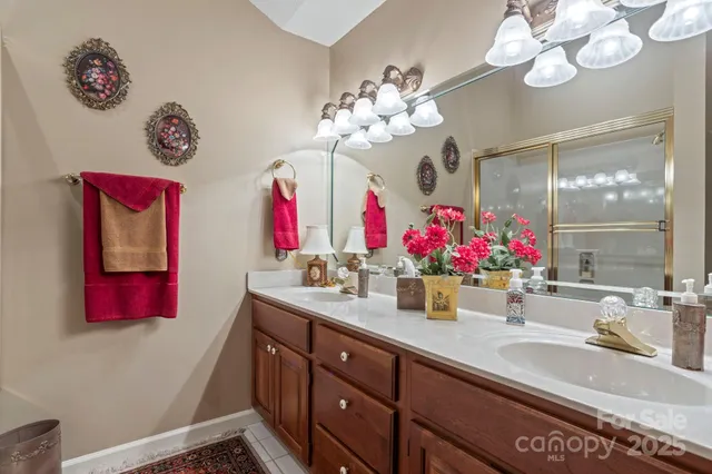 a bed room with two beds and a window