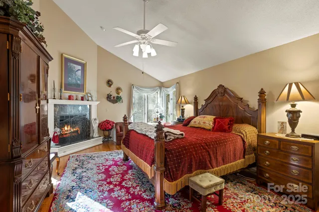 a bedroom with a bed and dresser with mirror