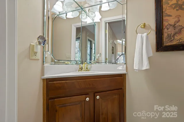 a bathroom with a double vanity sink a mirror and a bathtub
