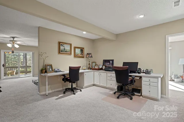 a bedroom with a bed lamp and large window