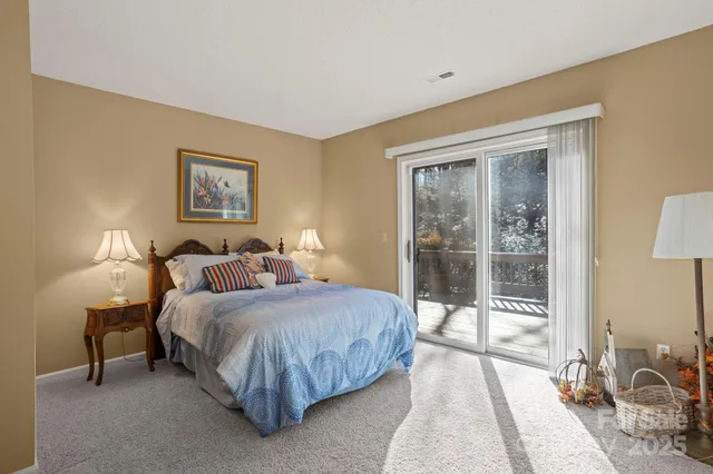 a bedroom with a bed and a dresser in it