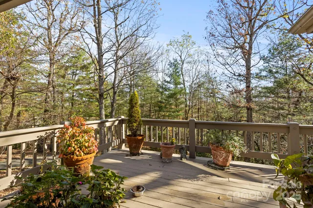 a view of a two chair and table in the balcony
