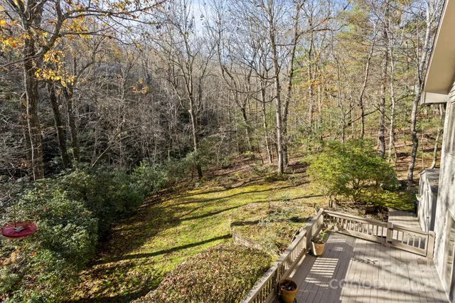 a view of a balcony with wooden floor