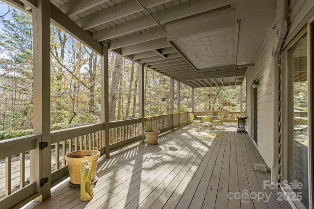 a view of a balcony with wooden floor