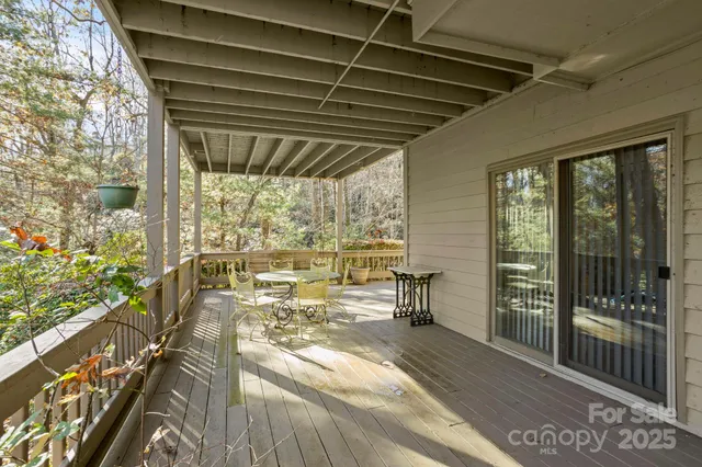a view of a balcony with car parked