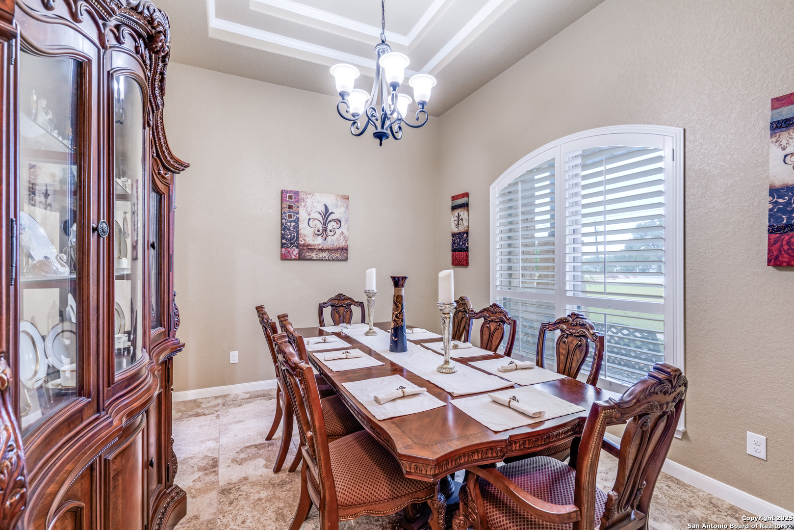 109 Bobcat Bend La Vernia, TX 78121 - Photo 11 of 36 a view of a dining room with furniture a chandelier and wooden floor