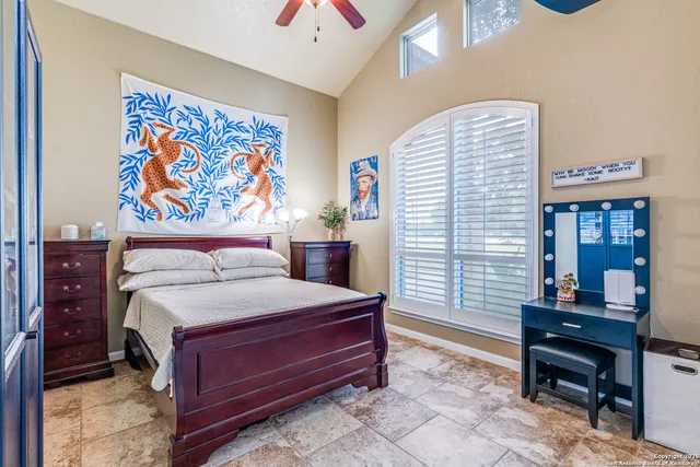 a bedroom with a bed and a furniture