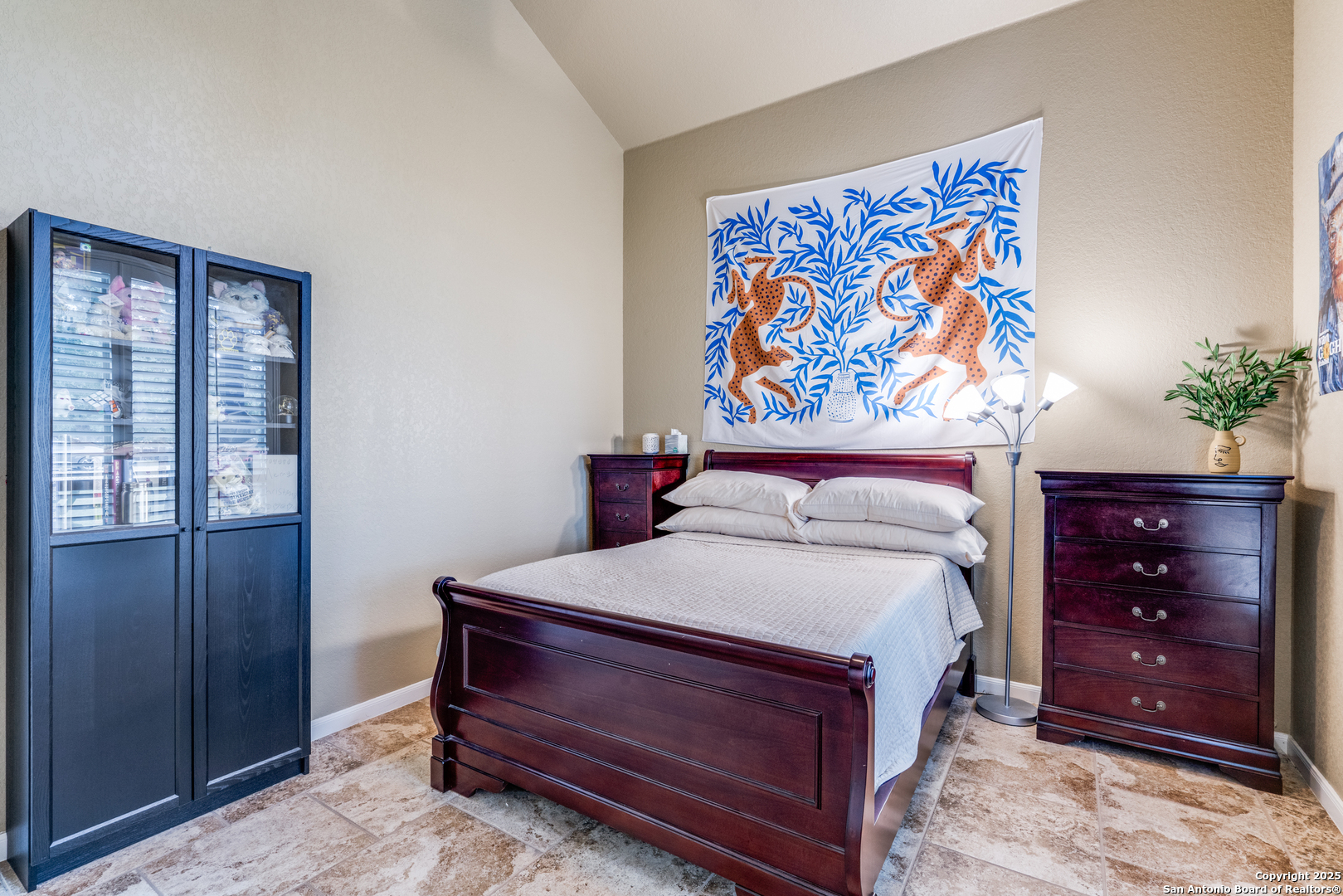 109 Bobcat Bend La Vernia, TX 78121 - Photo 14 of 36 a bedroom with a bed and a painting on the wall