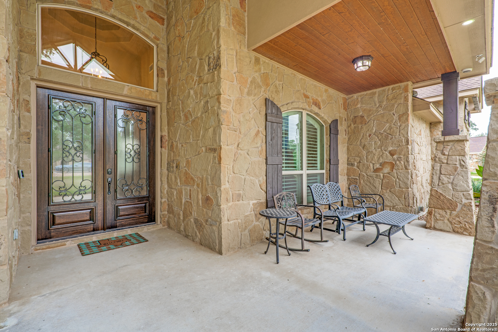109 Bobcat Bend La Vernia, TX 78121 - Photo 29 of 36 a living room with furniture and large windows