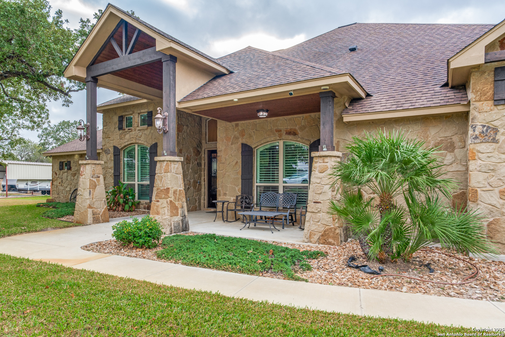109 Bobcat Bend La Vernia, TX 78121 - Photo 3 of 36 a front view of a house with garden