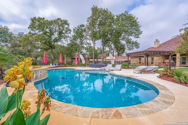 a view of a swimming pool with a patio