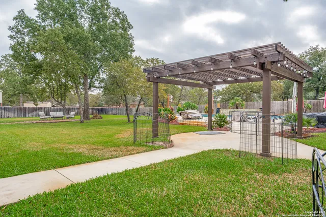 a view of a backyard with sitting area