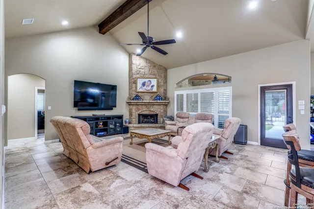 a living room with furniture fireplace and a flat screen tv