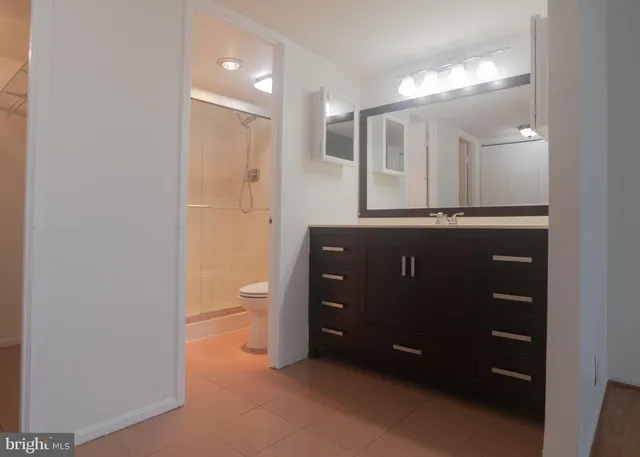 a room with a dresser and a mirror