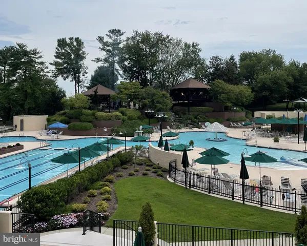 a view of a chairs and table in patio with a yard