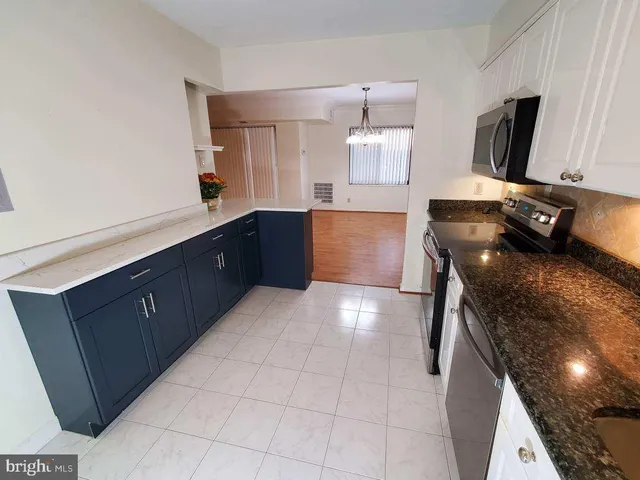 a view of a kitchen with a sink