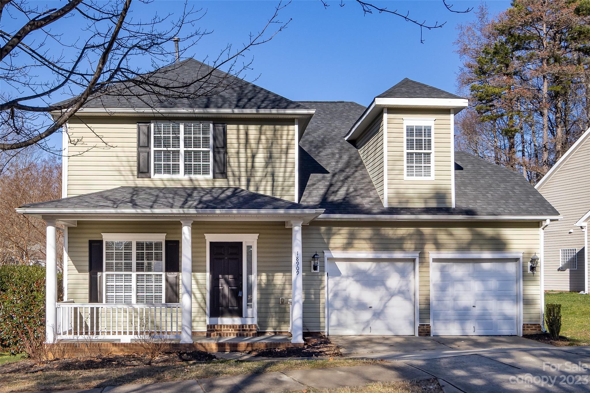 front view of a house with a yard