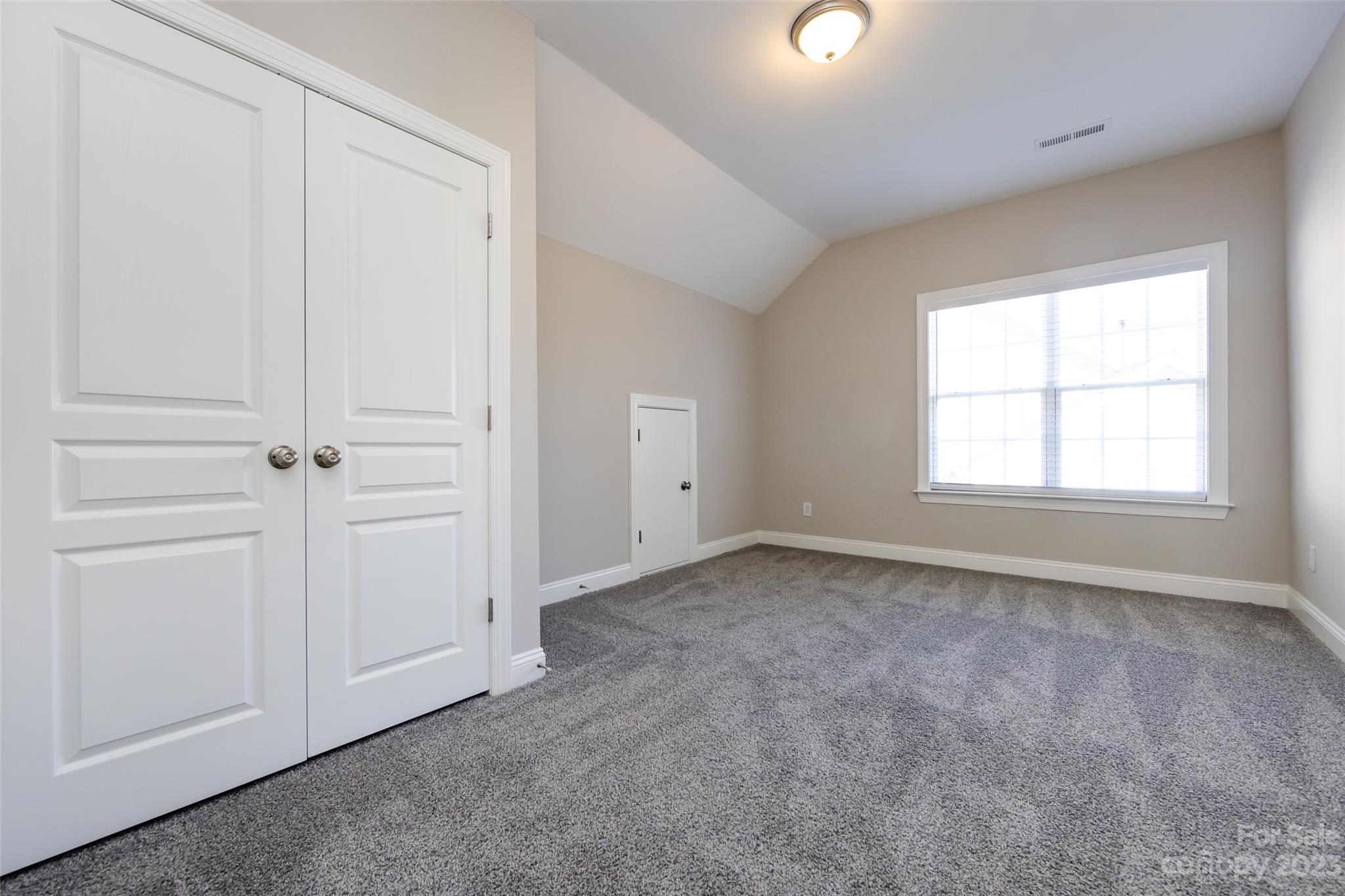18909 Ruffner Drive Cornelius, NC 28031 - Photo 17 of 22 an empty room with windows