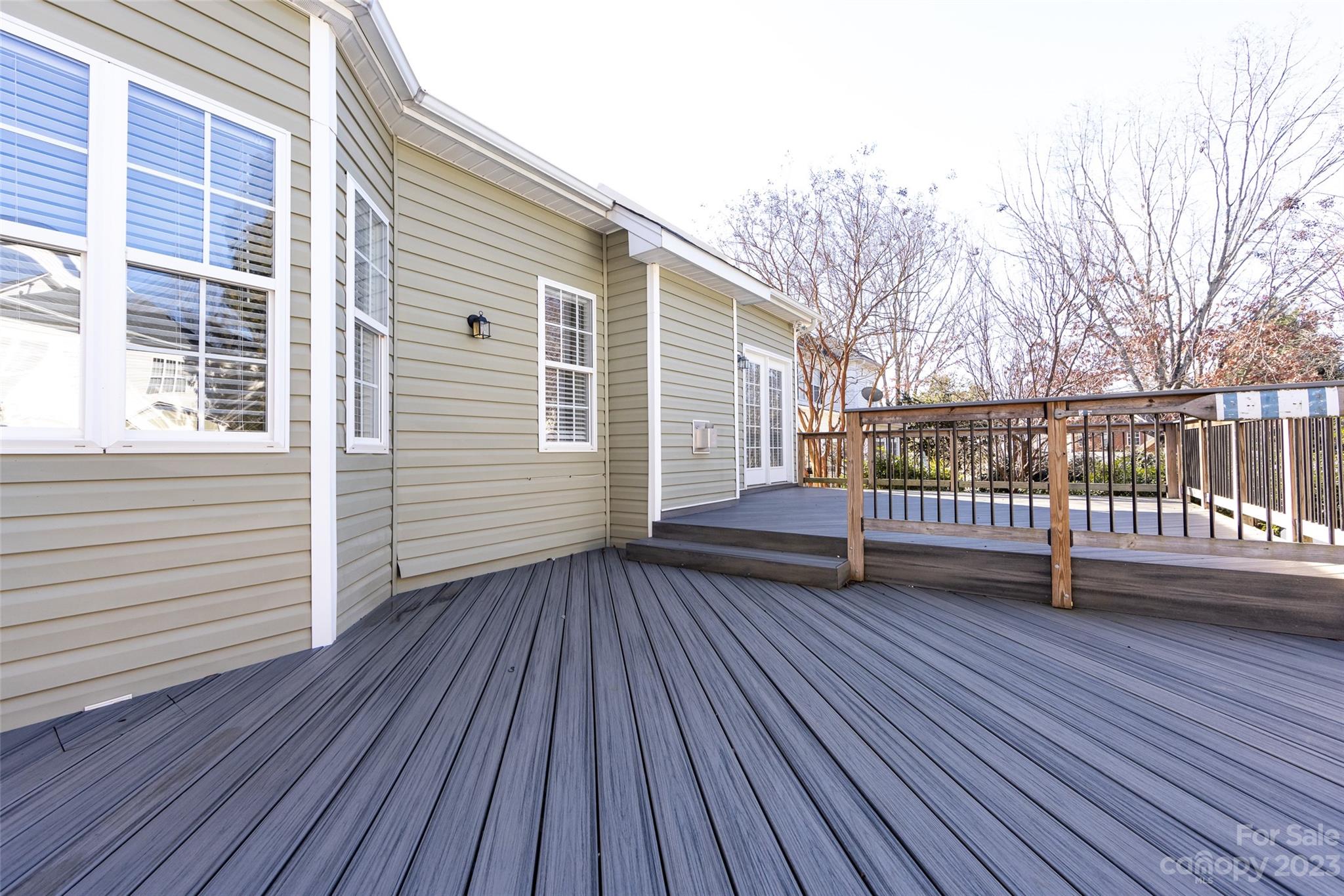 18909 Ruffner Drive Cornelius, NC 28031 - Photo 21 of 22 a view of a roof deck with wooden floor and fence