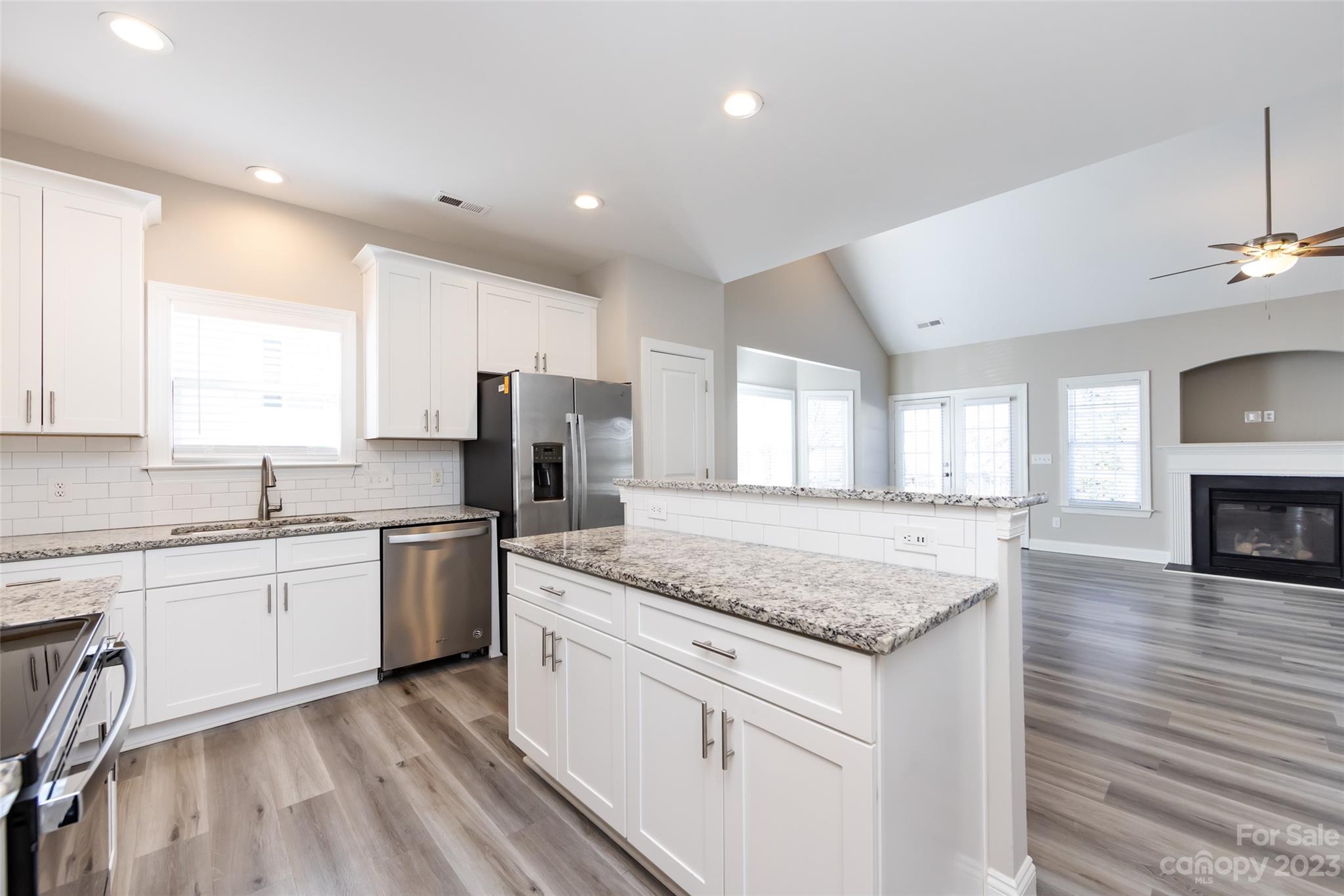 18909 Ruffner Drive Cornelius, NC 28031 - Photo 5 of 22 a kitchen with granite countertop cabinets stainless steel appliances a sink and a island