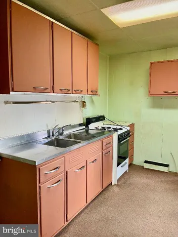 a view of a refrigerator in a kitchen
