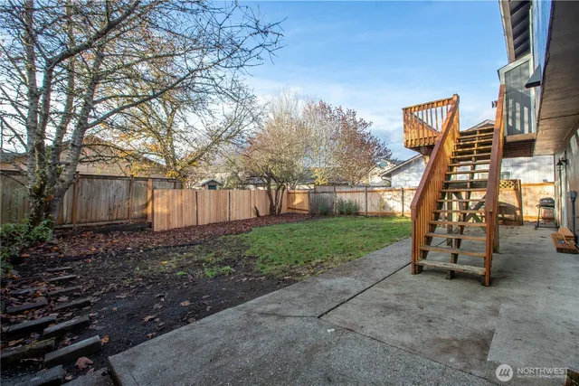 a backyard of a house with lots of green space